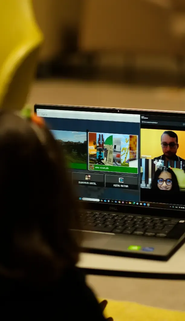Child learning Python on a computer